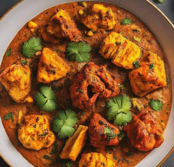 "Assorted Mix Tikka Masala featuring chicken, lamb, and paneer in a creamy, spiced tomato sauce, showcasing the diversity of Indian cuisine."